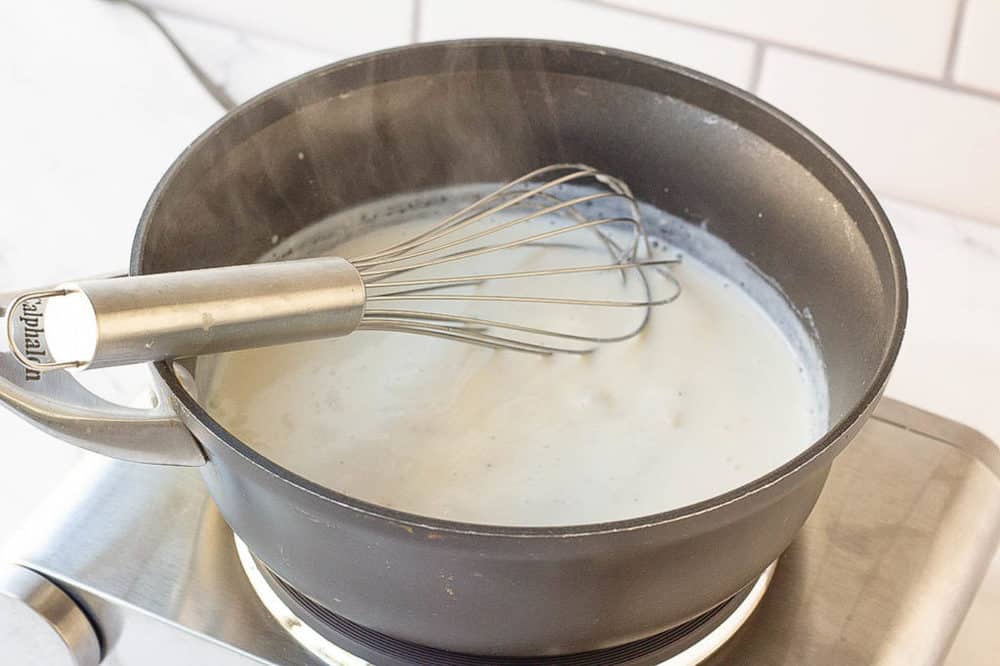 cheese sauce cooking on the stovetop