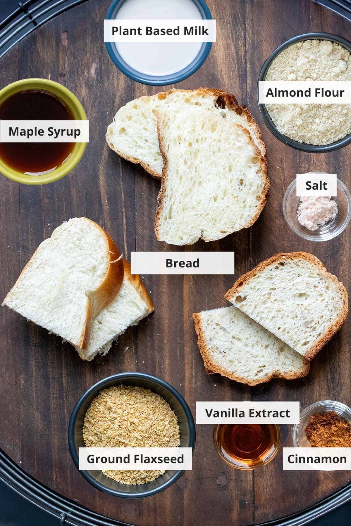 Ingredients for vegan french toast sticks on a wood background.