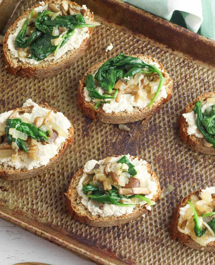 spinach and mushrooms added to toast