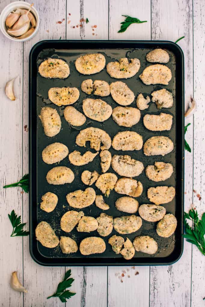 breaded mushrooms, mushroom nuggets on a baking sheet