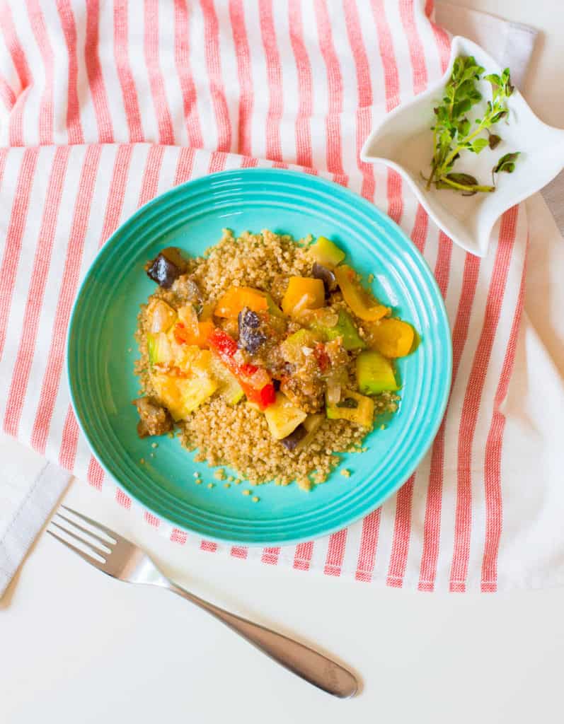vegan ratatouille with seasonal vegetables in a blue bowl