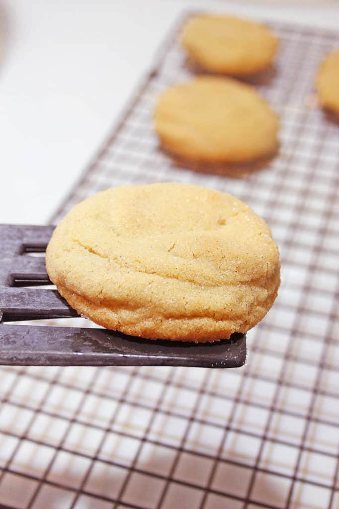 cookie on a spatula above a baking sheet