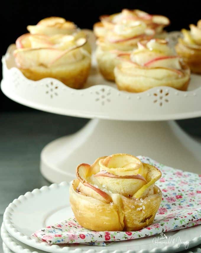 a romantic dessert of puff pastry apples in the shape of a rose