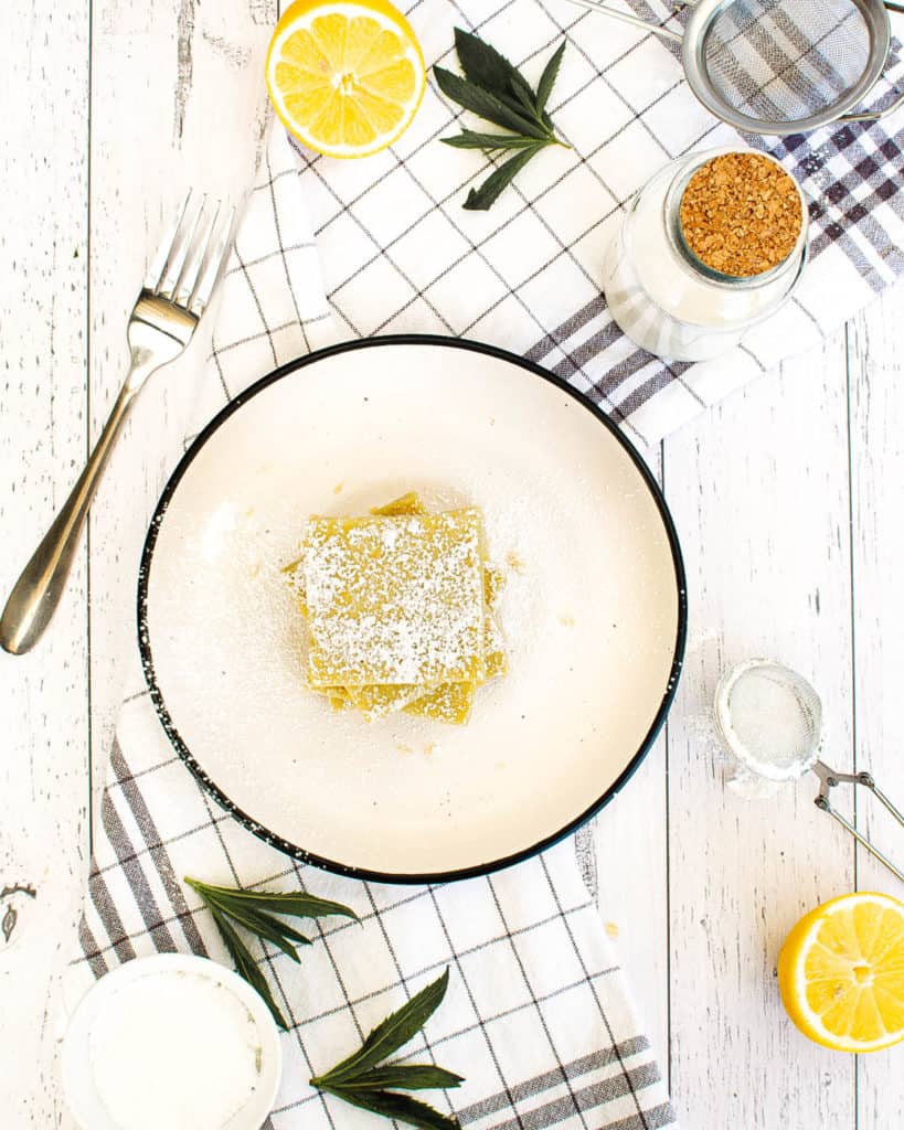 top view of vegan gluten free lemon bars on a white plate