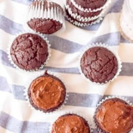 healthy chocolate cupcakes on a blue and white cloth