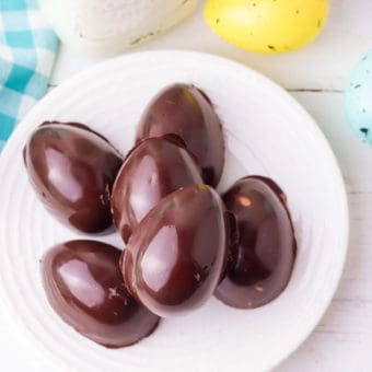 homemade peanut butter eggs on a white plate - reese's egg makeover