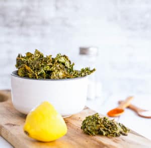 Garlic Parmesan Oven Baked Kale Chip Recipe in a white bowl