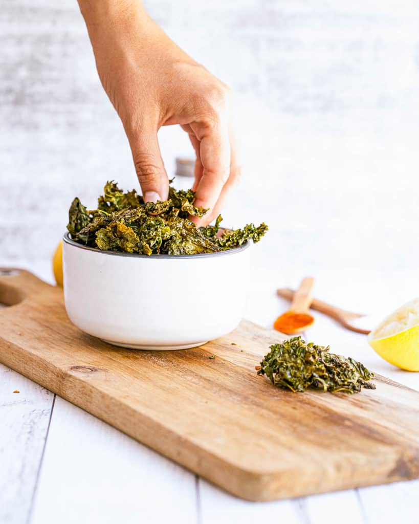 Garlic Parmesan Oven Baked Kale Chip Recipe in a white bowl