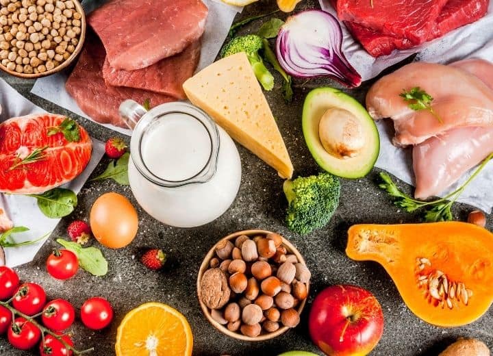 milk, cheese, nuts, meat, fish, and produce on display