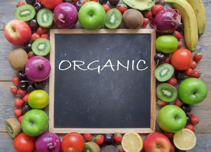 fruits and vegetables around a chalkboard that says 