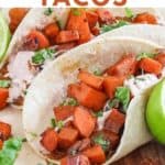 sweet potato tacos on serving tray with lime wedges