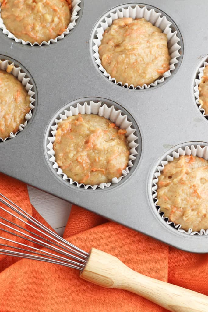carrot cake cupcake batter added to muffin tins