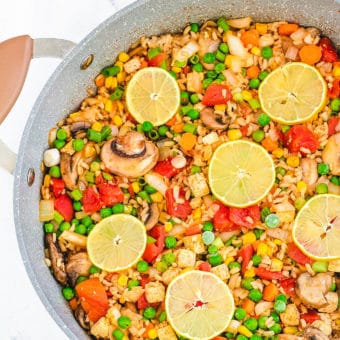 vegan paella with tofu served in a large skillet