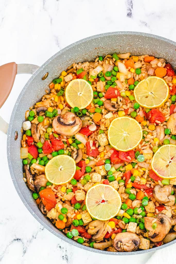 vegan paella with tofu served in a large skillet