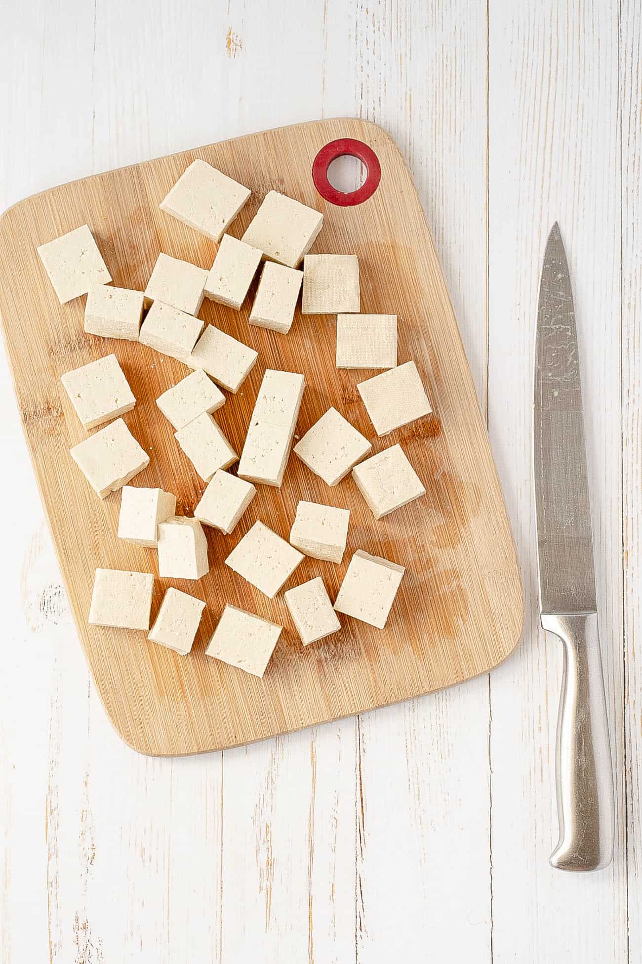 chopped tofu on a cutting board