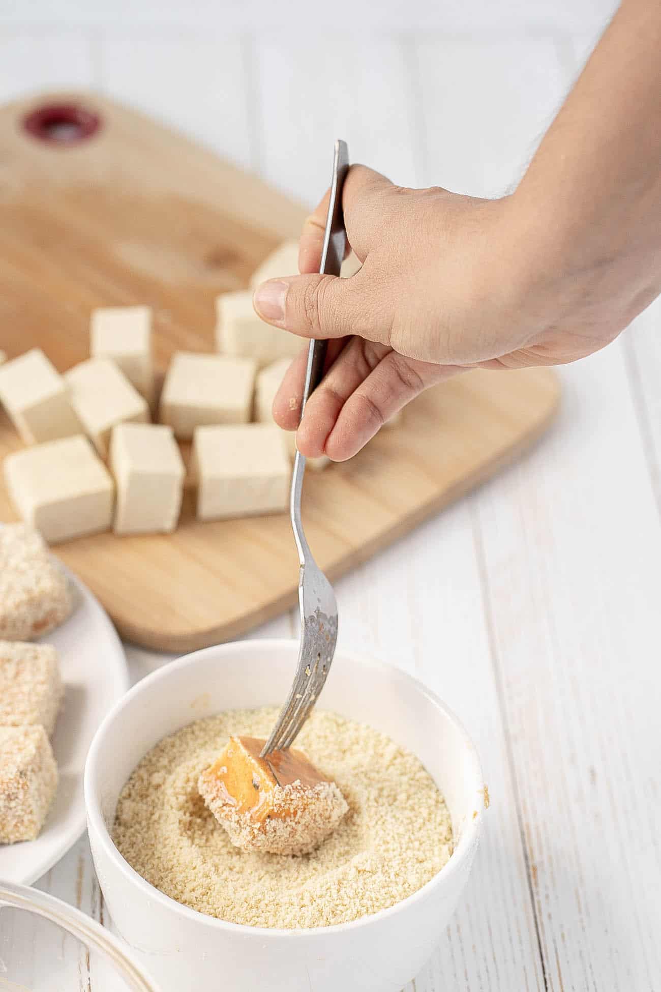 tofu dipped into spices & vegan egg mixture