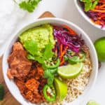 bbq jackfruit served in a white bowl with burrito fixings