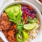 bbq jackfruit burrito bowl with rice, guacamole, and beans