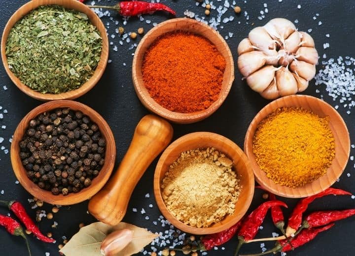 assorted spices in small bowls