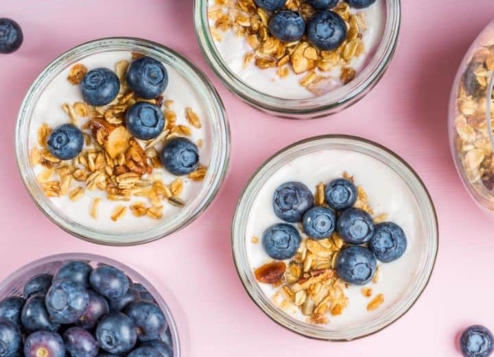 parfait topped with blueberries and granola