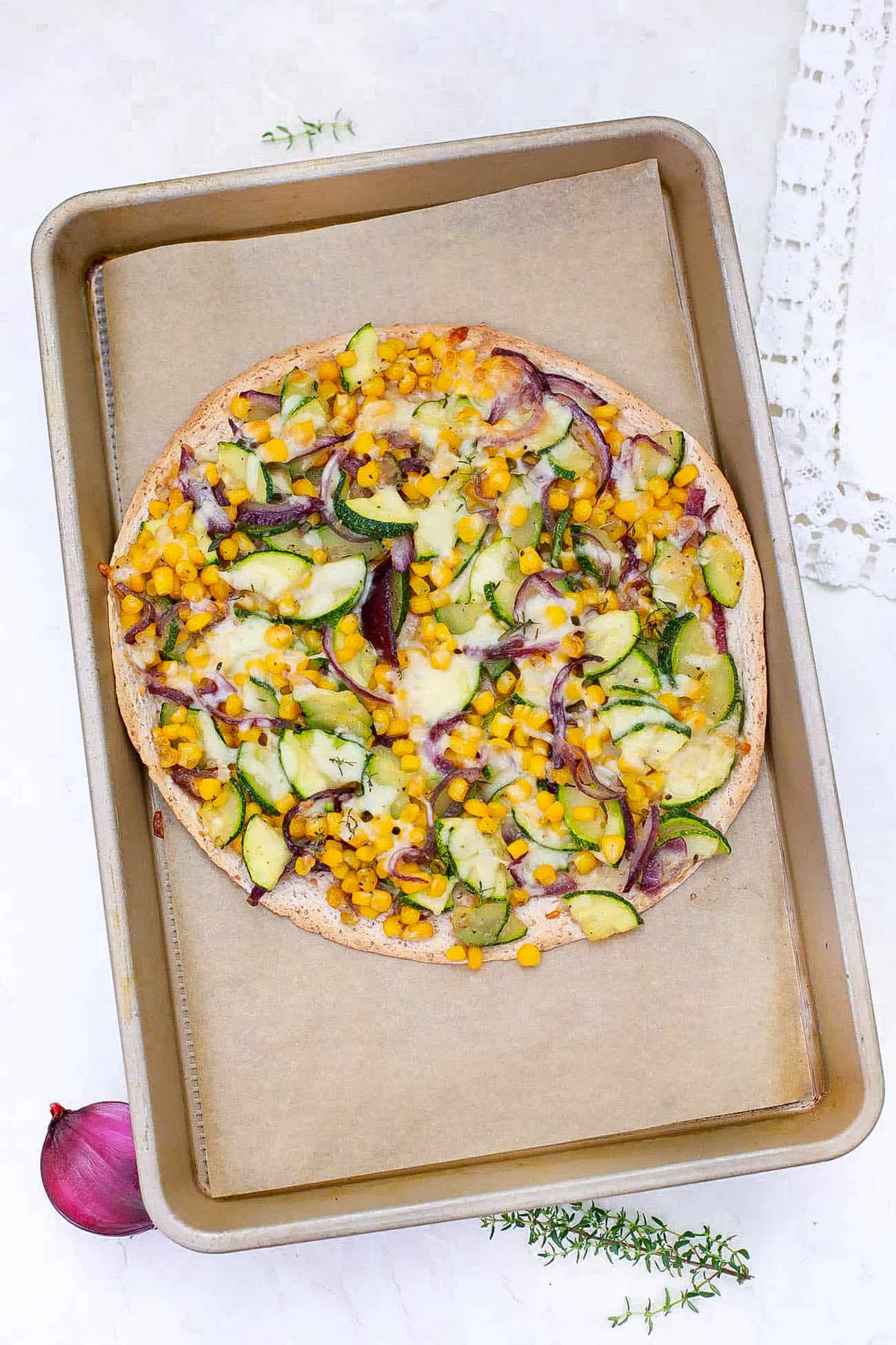 corn flatbread on a baking sheet