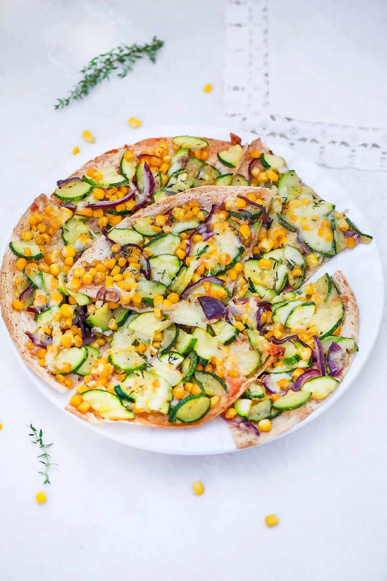 zucchini flatbread - corn flatbread on a white plate