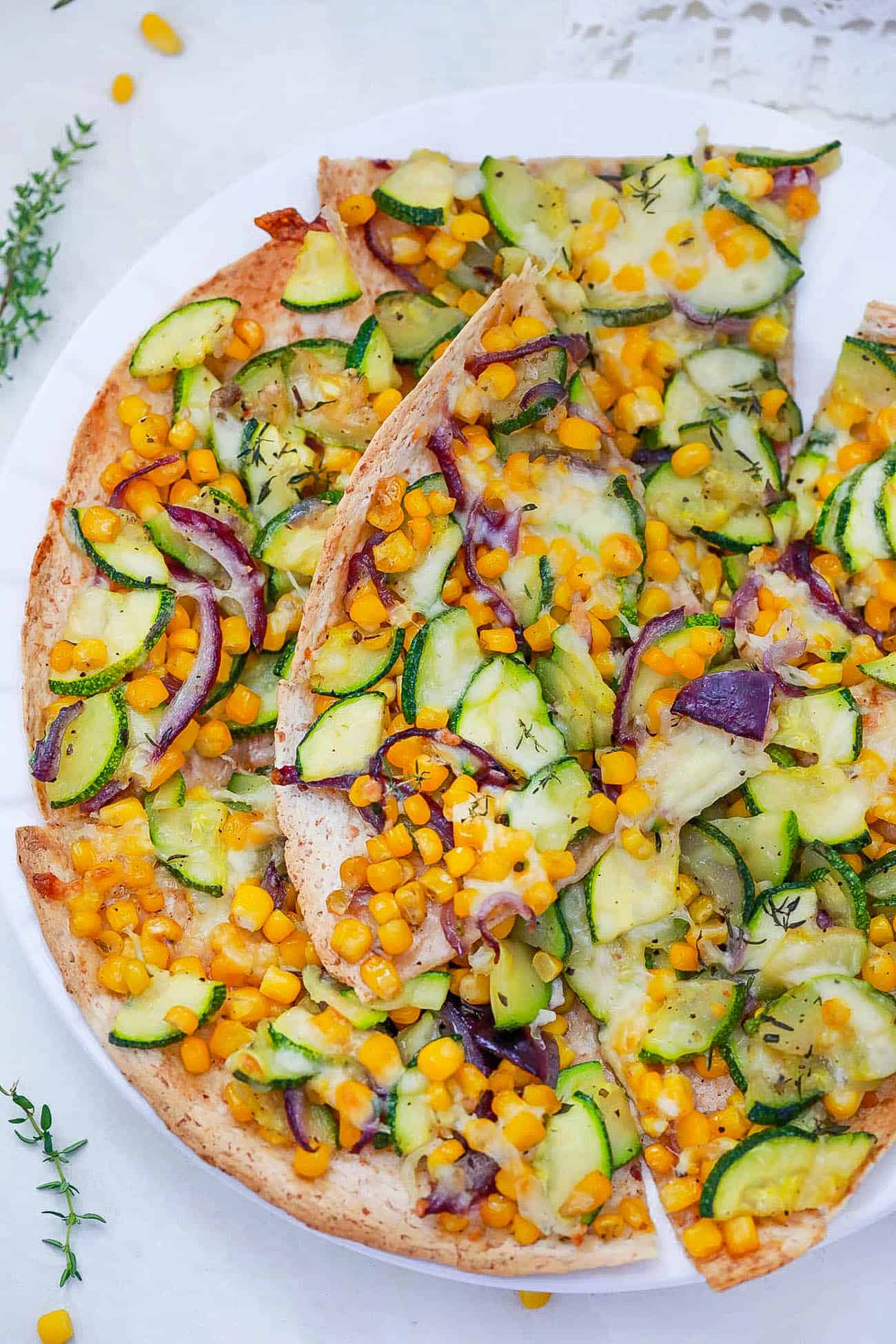 zucchini flatbread - corn flatbread on a white plate