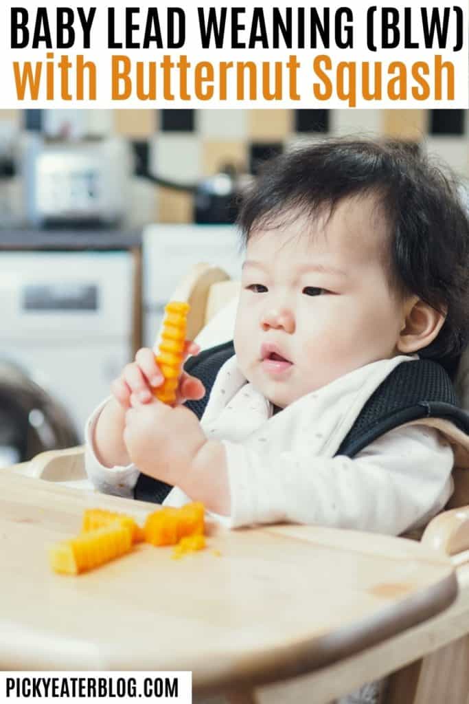 baby in high chair eating small bite sized pieces of butternut squash