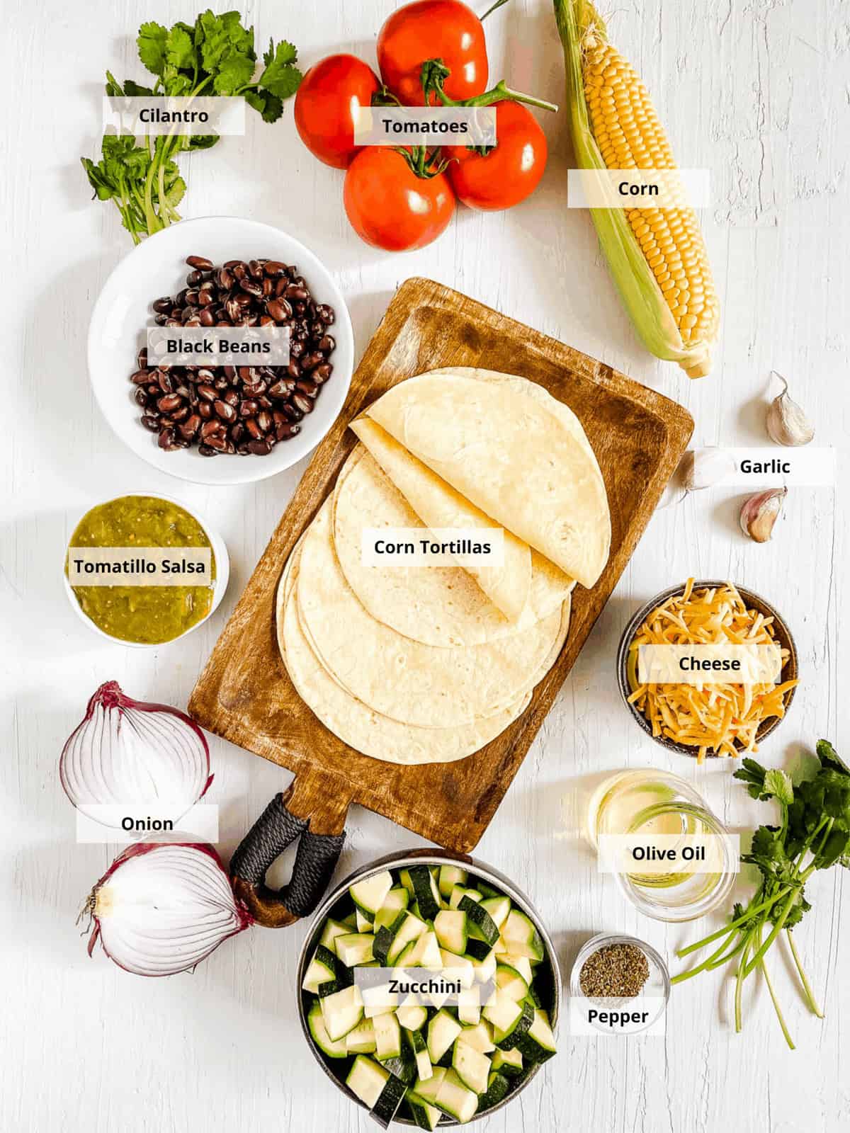 Ingredients for black bean tostadas recipe on a white background.