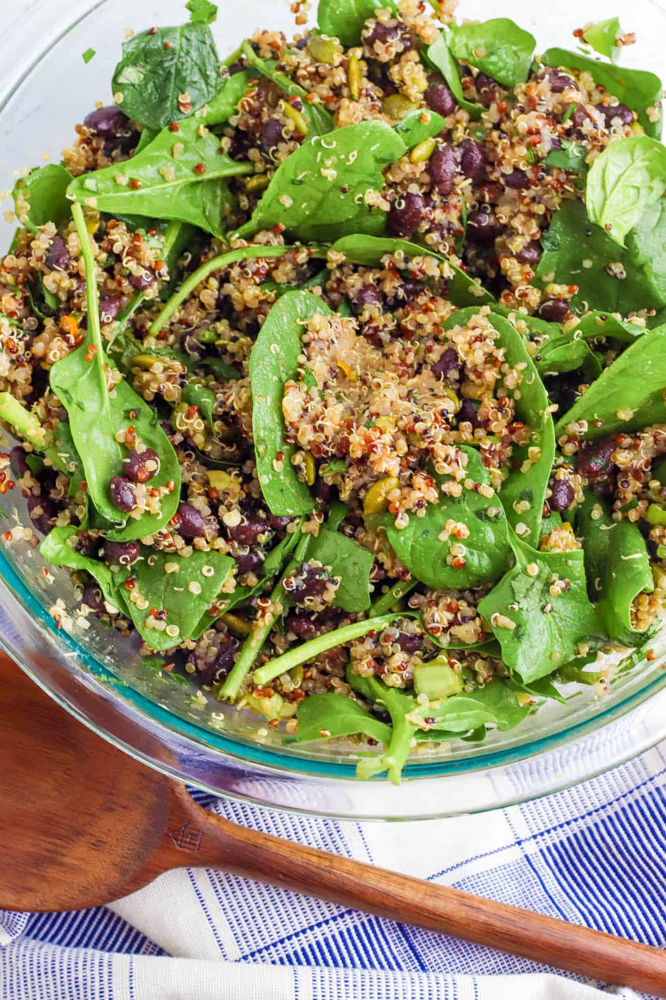 spinach and quinoa tossed in a bowl