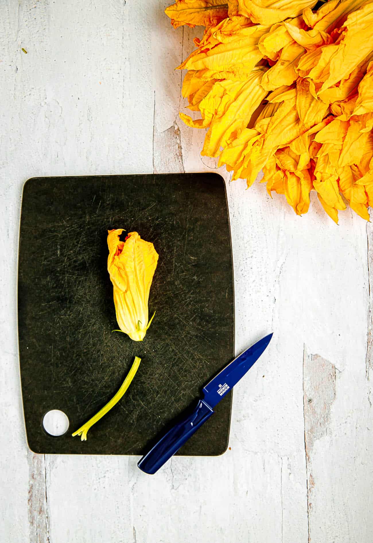 zucchini blossoms on a cutting board