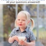 little girl drinking glass of milk