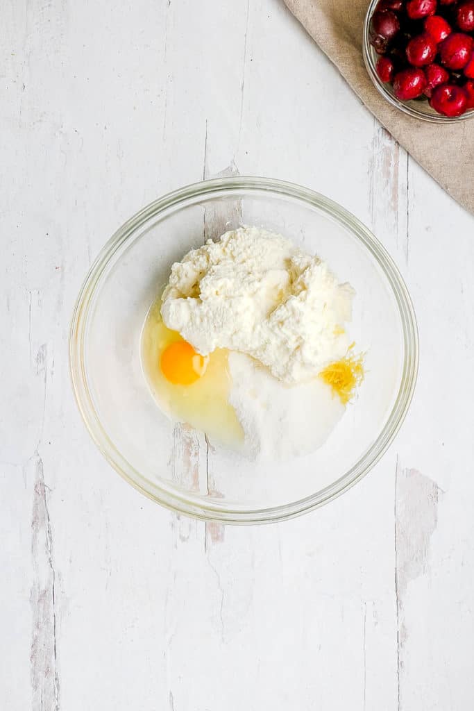 eggs ricotta salt lemon zest combined in a bowl