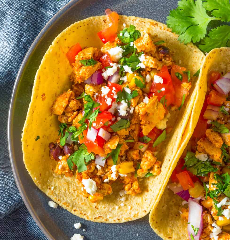 Healthy Homemade chipotle copycat Sofritas Tofu Tacos with Tomato Onion and Cilantro