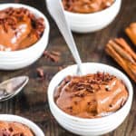 healthy chocolate pudding served in white bowls topped with chocolate shavings