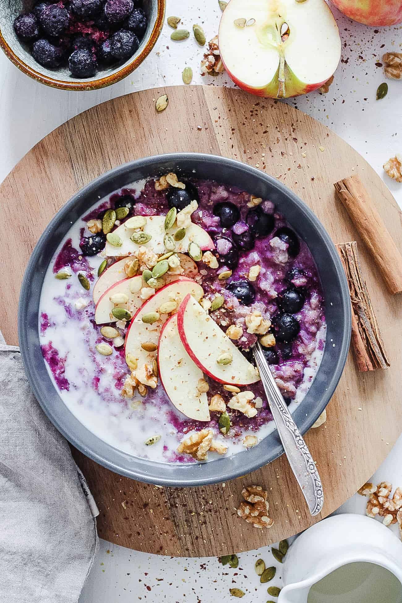 how to make oatmeal taste good - blueberry oatmeal on a wooden cutting board