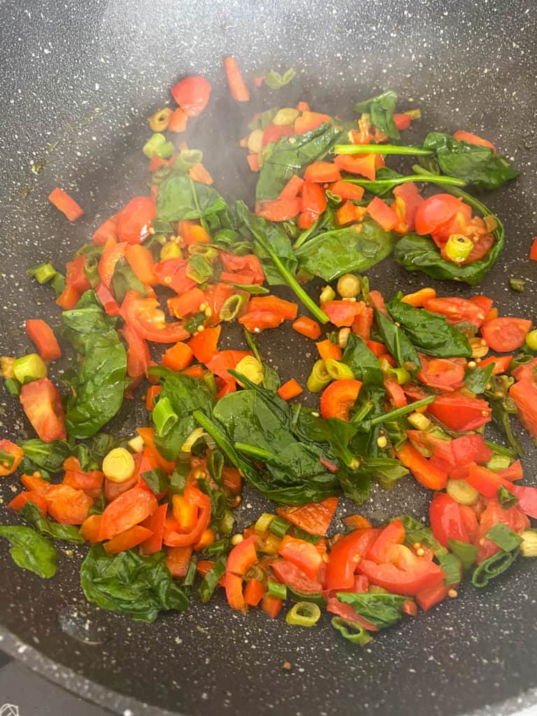 veggies cooking in a pan