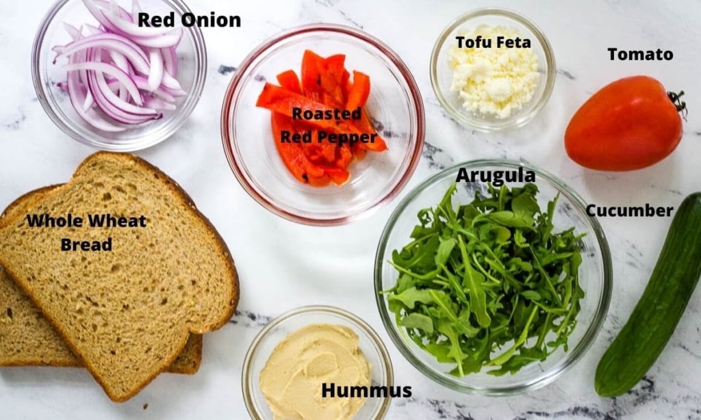 red onion, roasted red peppers, tofu feta, roma tomato, cucumber, arugula, hummus, and whole wheat bread