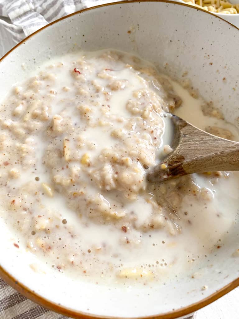 milk added to oats in a bowl