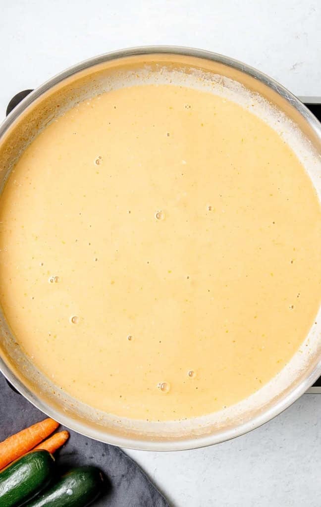 Panang curry sauce in a pot on the stove.