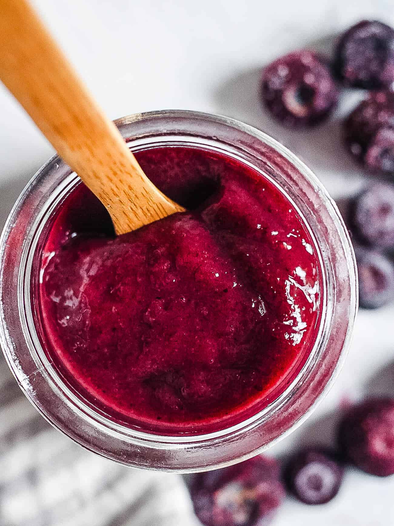 blueberry puree baby food in a glass jar