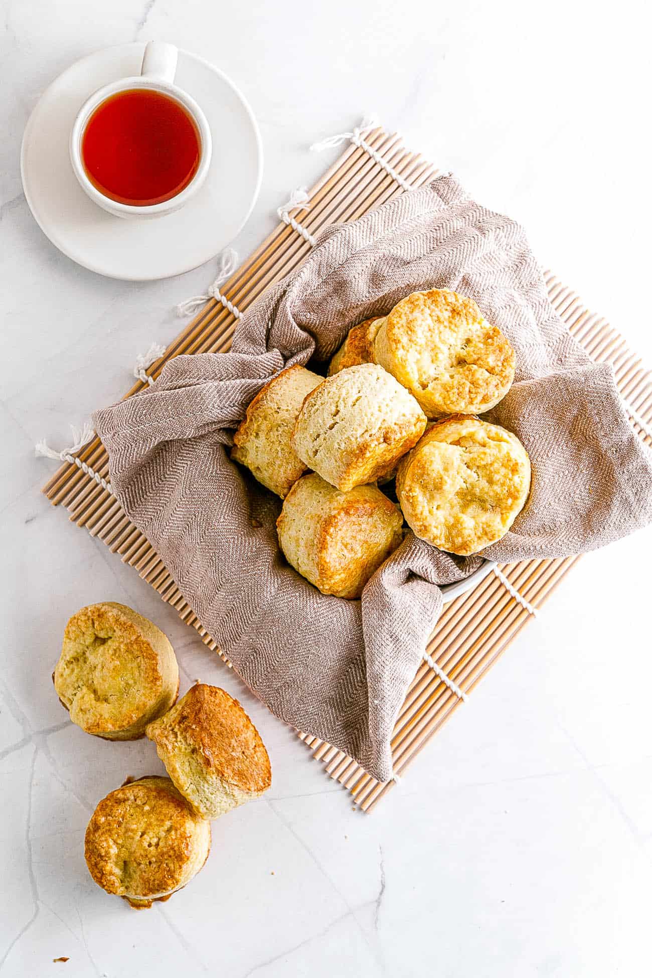 Easy Biscuit Recipe without Baking Powder - biscuits stacked in a bowl and on top of each other