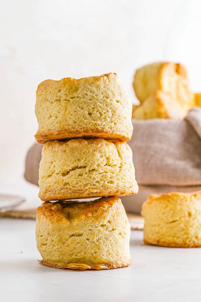 Easy Biscuit Recipe without Baking Powder - biscuits stacked in a bowl and on top of each other
