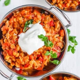 instant pot dal in a stainless steel bowl with a dollop of yogurt on top