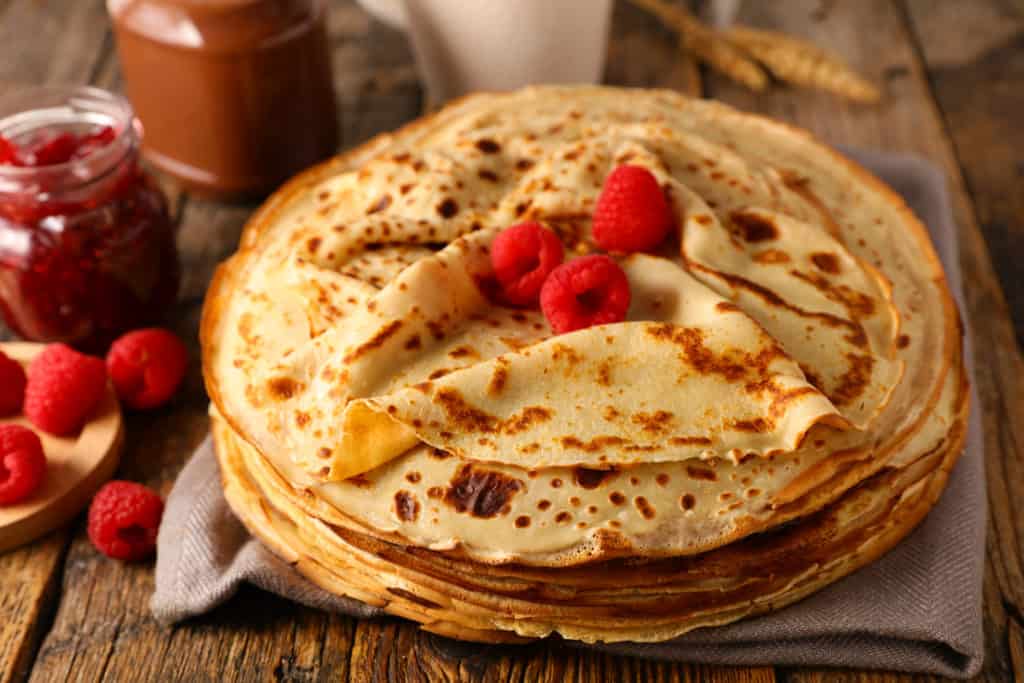 stack of crepe with raspberry and chocolate