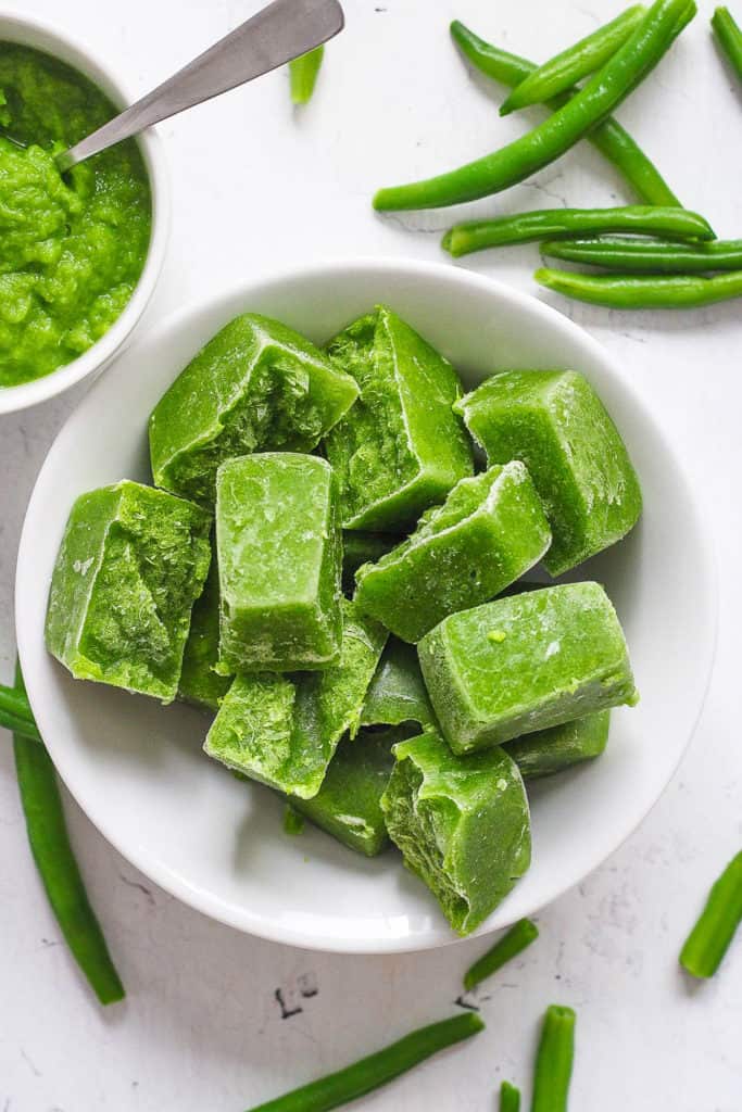 green bean puree ice cubes in bowl