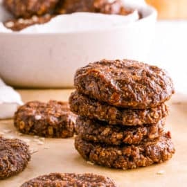 no bake cookies without peanut butter on brown parchment paper with rolled oats sprinkled on top