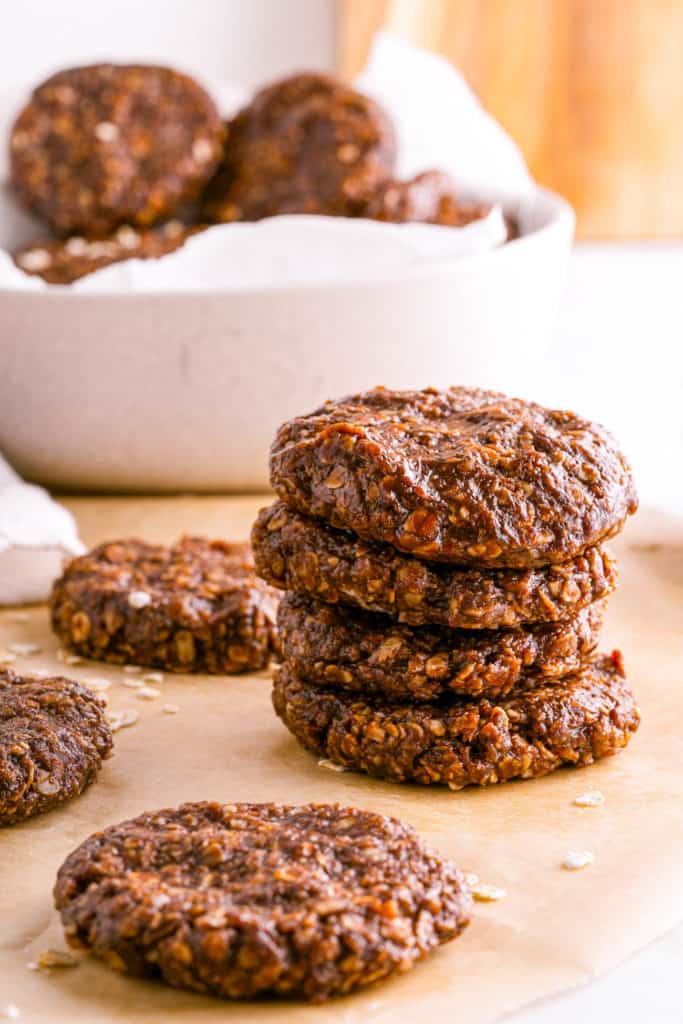 no bake cookies without peanut butter on brown parchment paper with rolled oats sprinkled on top