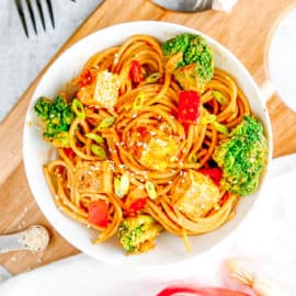 peanut sauce for noodles - thai noodles with broccoli tofu and peanut sauce in a white bowl