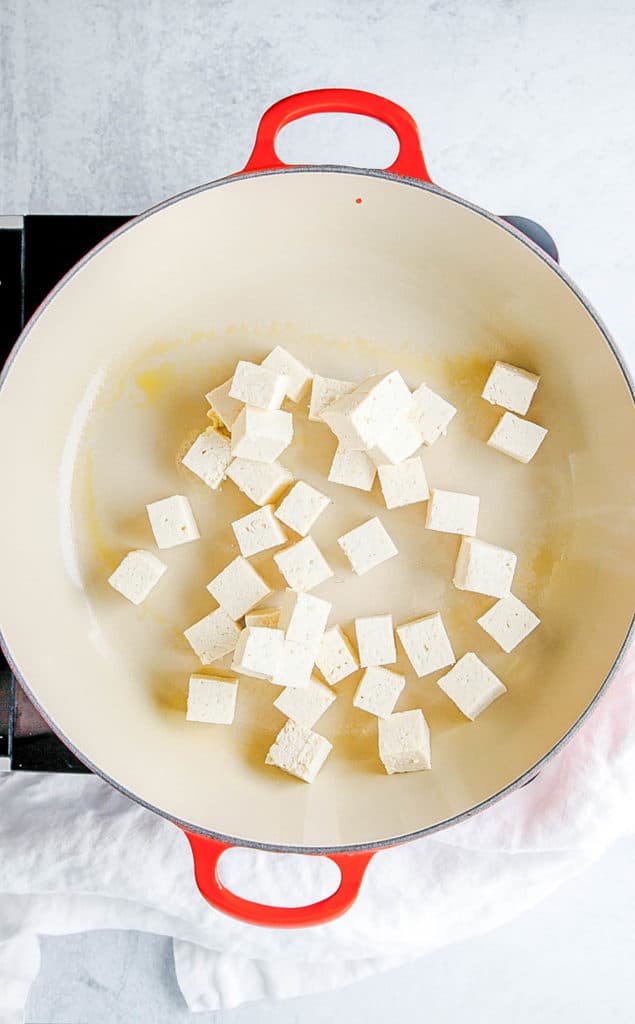 tofu sauteeing in a pot